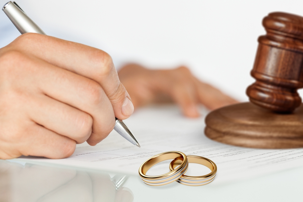 person signing divorce papers