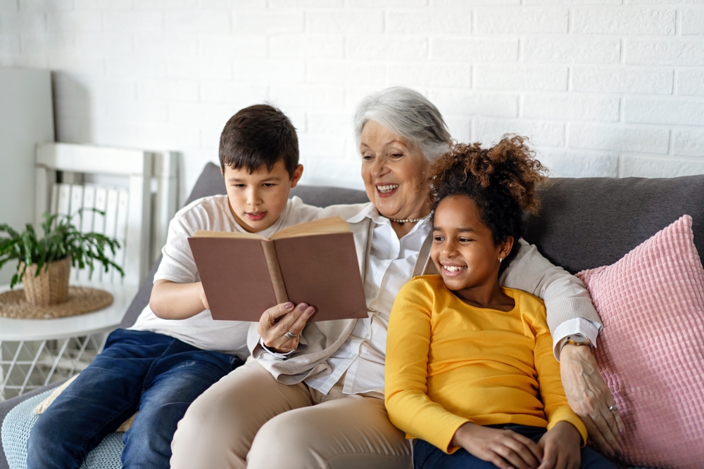 grandma reading to her grandchildren